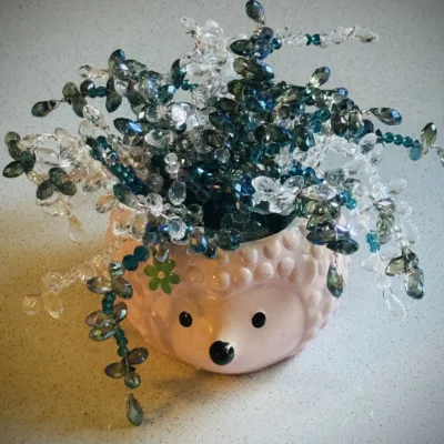 Blue and Clear Beaded Plant Sun Catcher in Hedgehog Planter